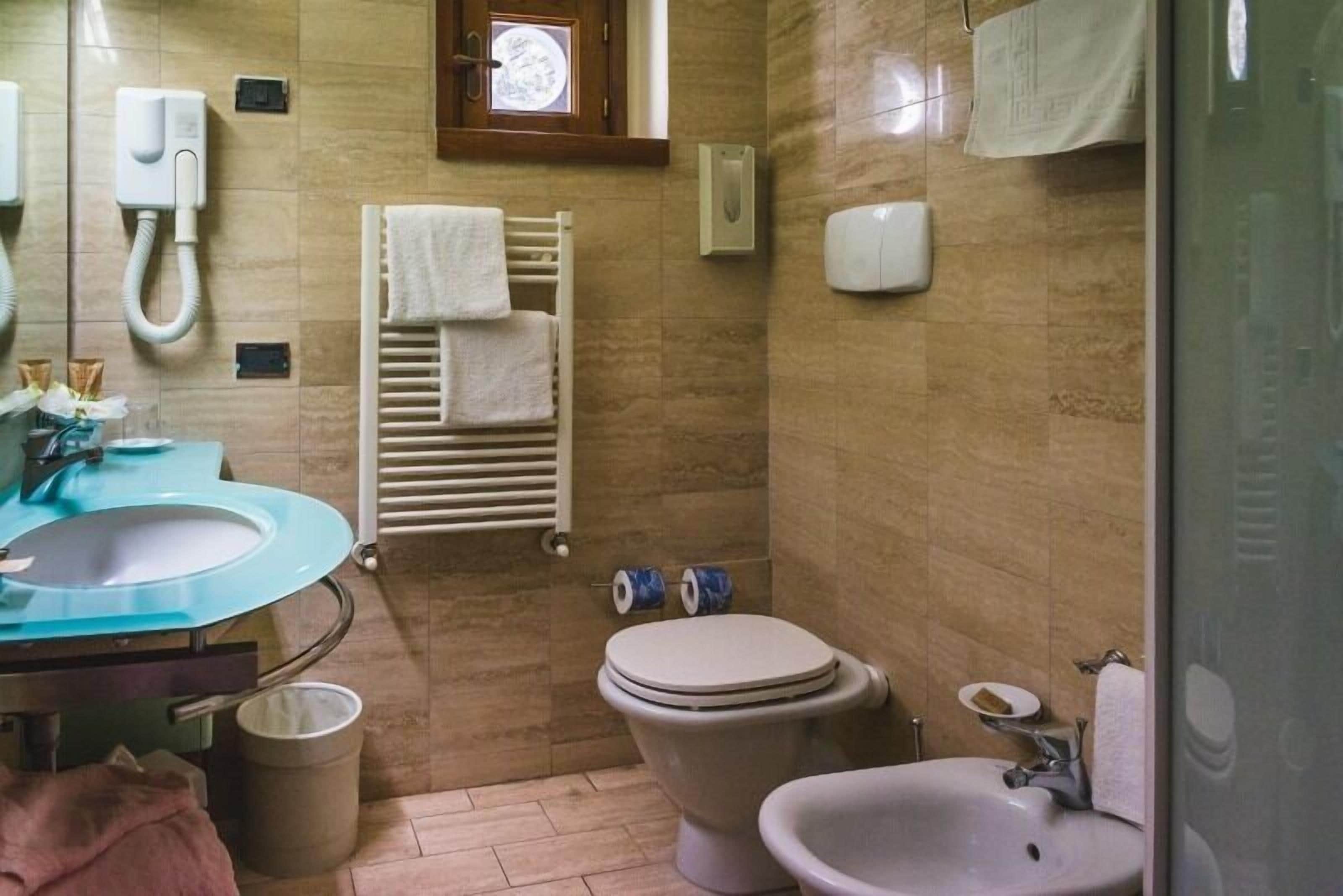 standard double room | bathroom | shower, hair dryer, bidet, towels