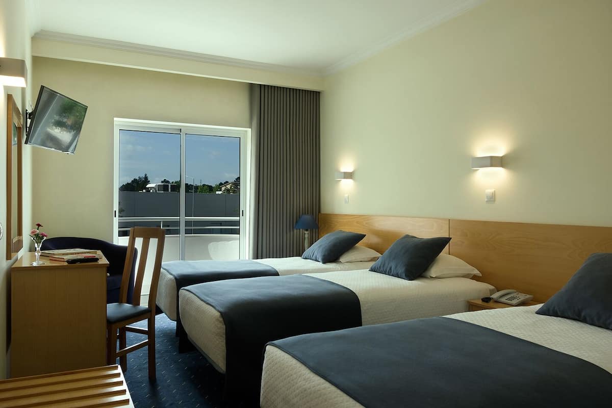 Triple Room | Desk, blackout drapes, soundproofing, free cribs/infant beds