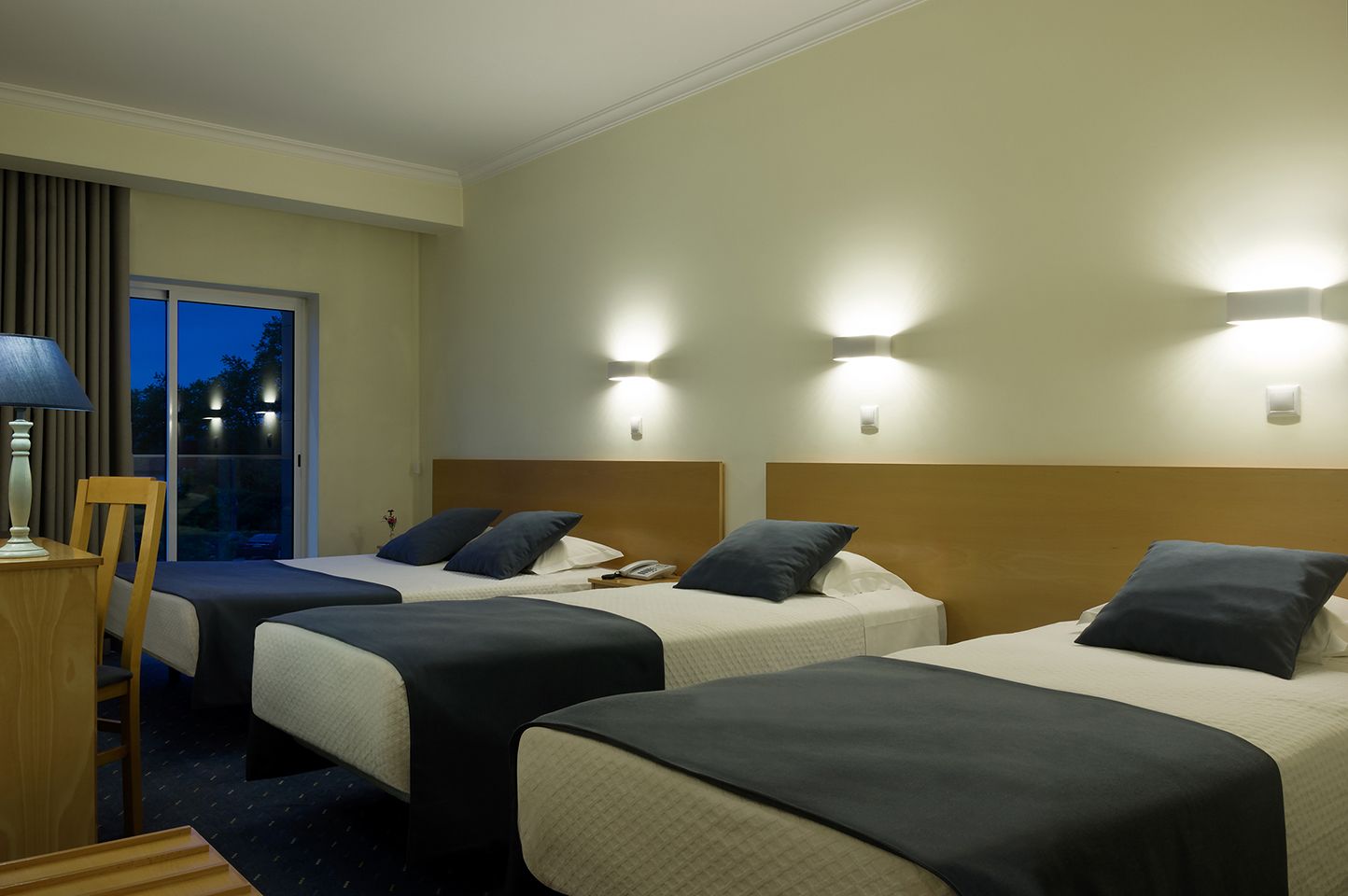 family room | desk, blackout curtains, soundproofing, free cots/infant beds