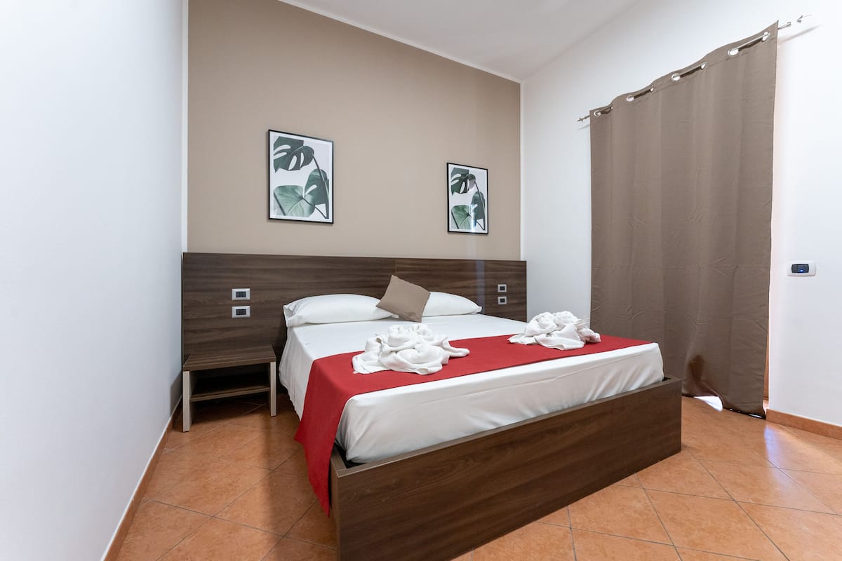 family room | 1 bedroom, minibar, in-room safe, desk