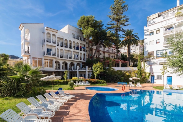 Seasonal outdoor pool, open 11:00 AM to 8:00 PM, pool umbrellas