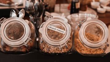 Three glass jars with metal clasps, each labeled with different text.