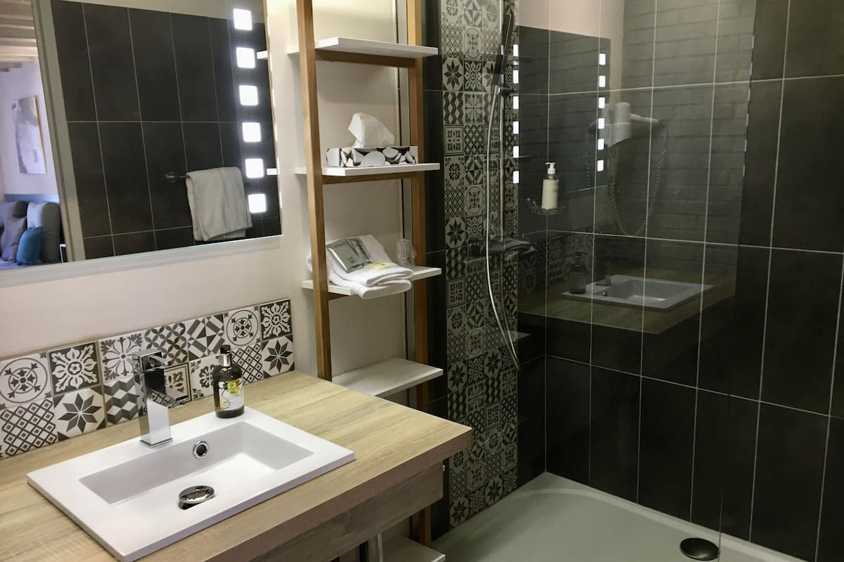 superior single room | bathroom | hair dryer, towels