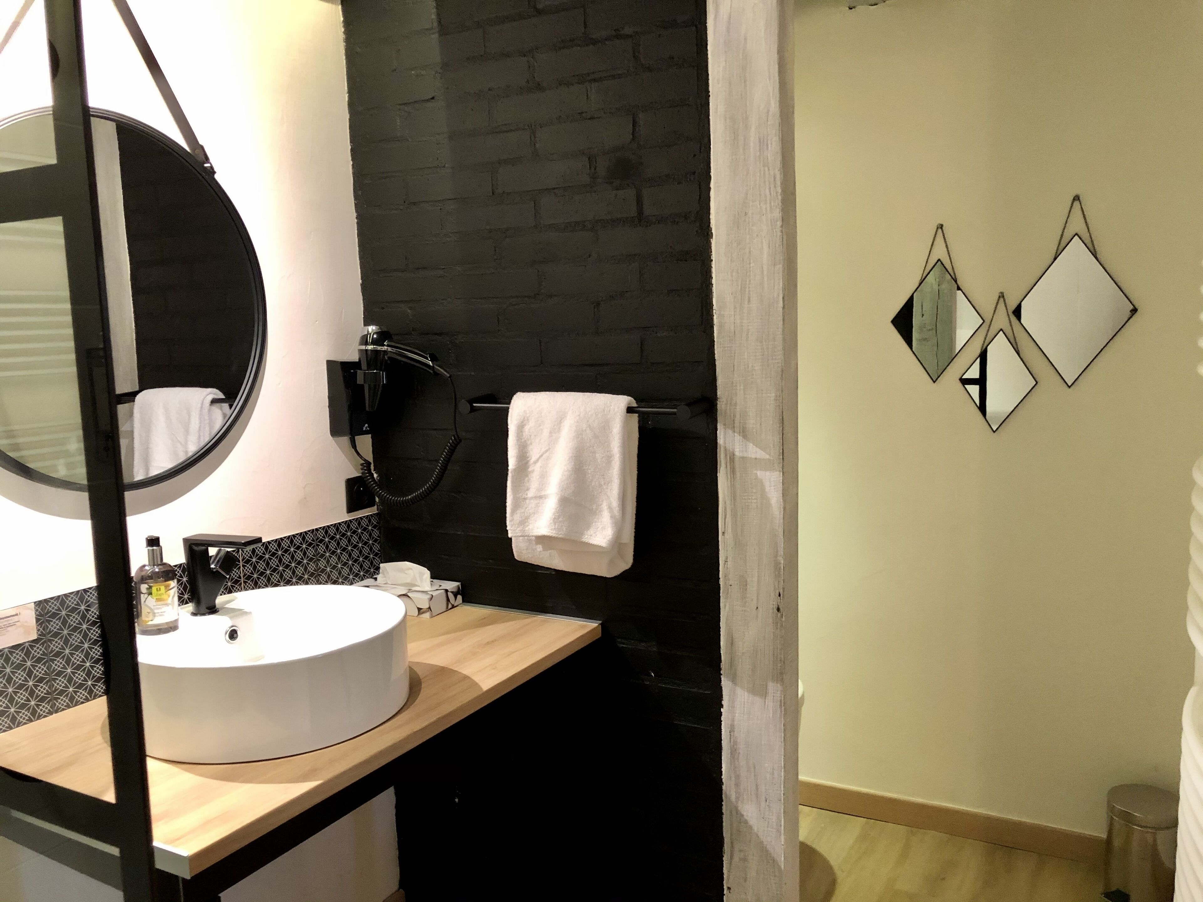superior single room | bathroom | hair dryer, towels