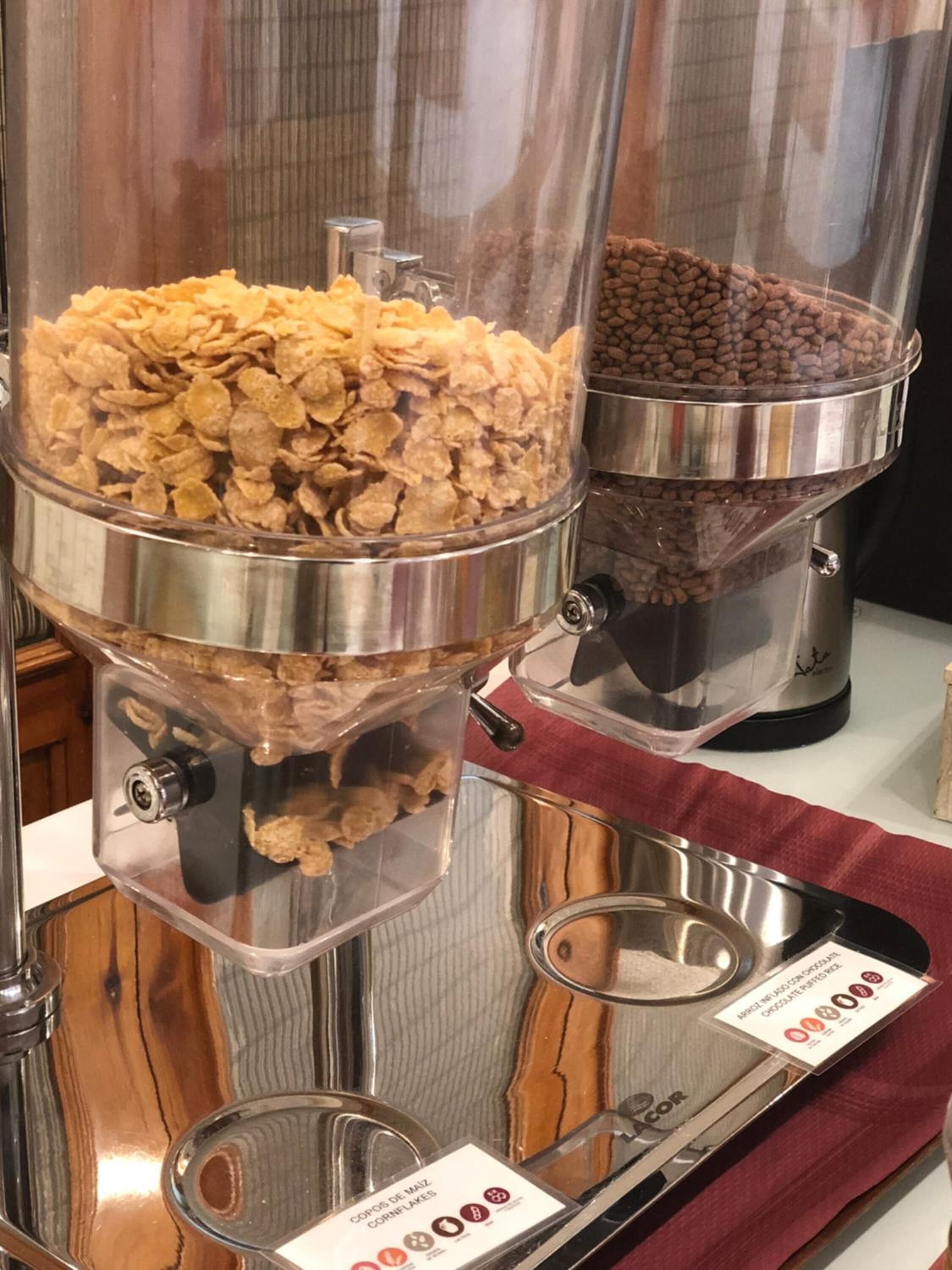 A food dispenser with cereal and chocolate chips.