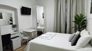 Basic Double Room, 1 Double or 2 Twin Beds, Non Smoking | Down comforters, in-room safe, desk, free WiFi