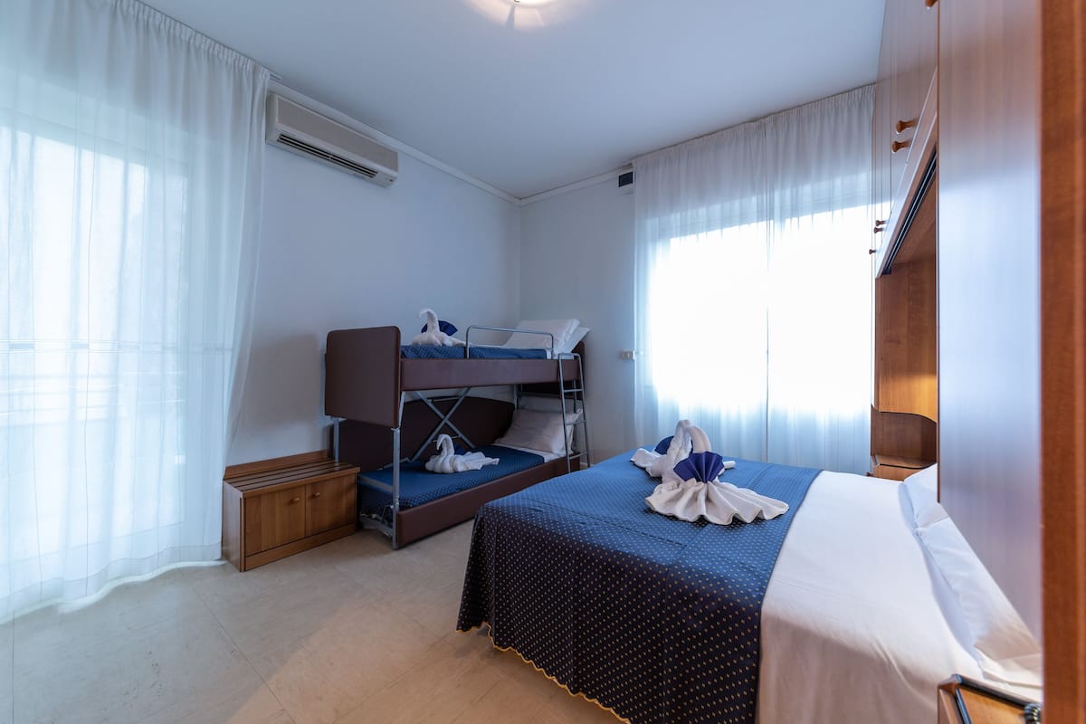 Quadruple Room | Pillowtop beds, minibar, in-room safe, desk