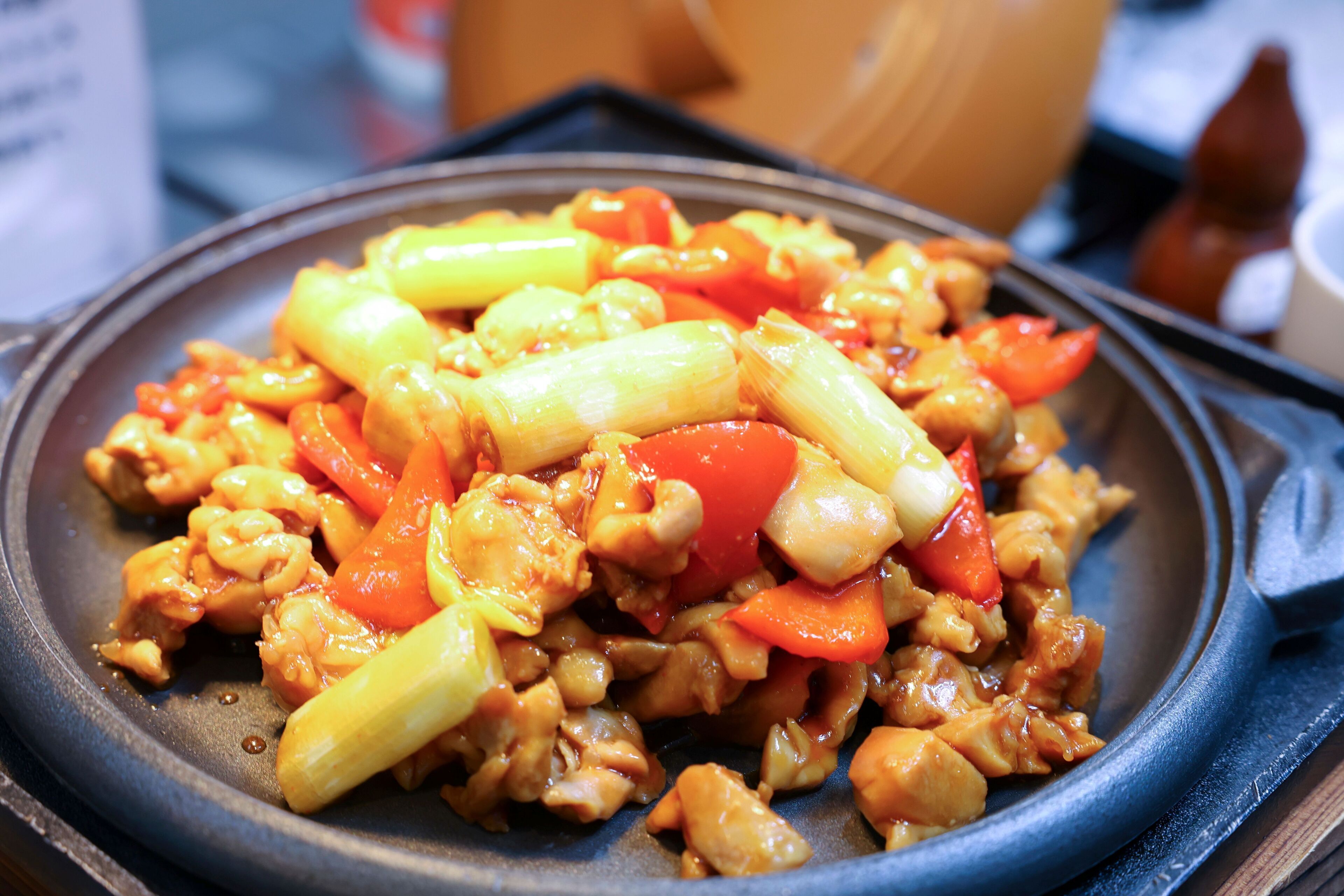 A close-up of a stir-fried dish with vegetables and meat.