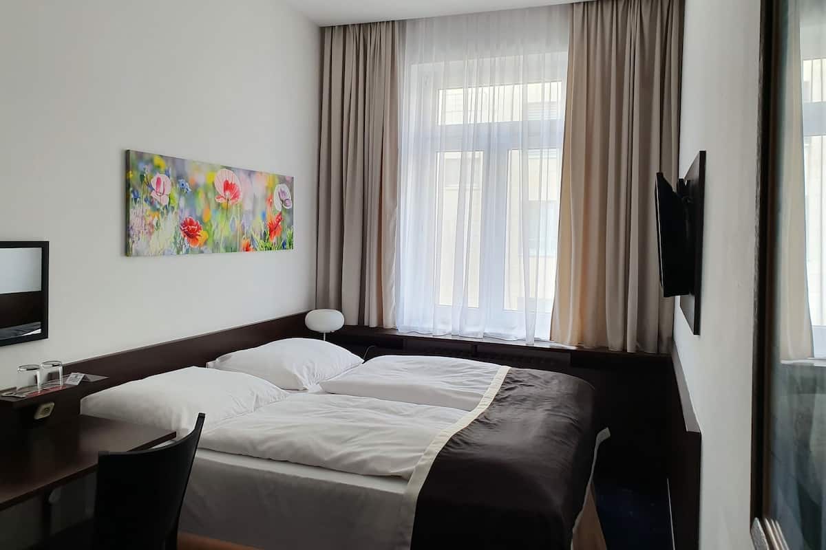 Standard Double or Twin Room | Minibar, in-room safe, desk, iron/ironing board