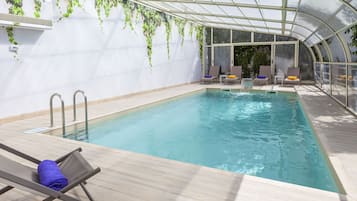 Indoor pool, seasonal outdoor pool, pool umbrellas, sun loungers