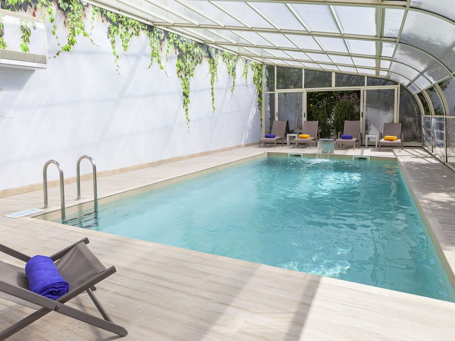 Indoor pool, seasonal outdoor pool, pool umbrellas, sun loungers