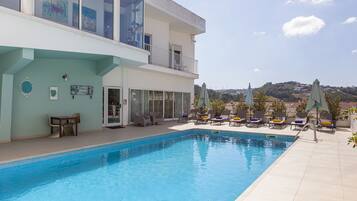 Indoor pool, seasonal outdoor pool, pool umbrellas, sun loungers