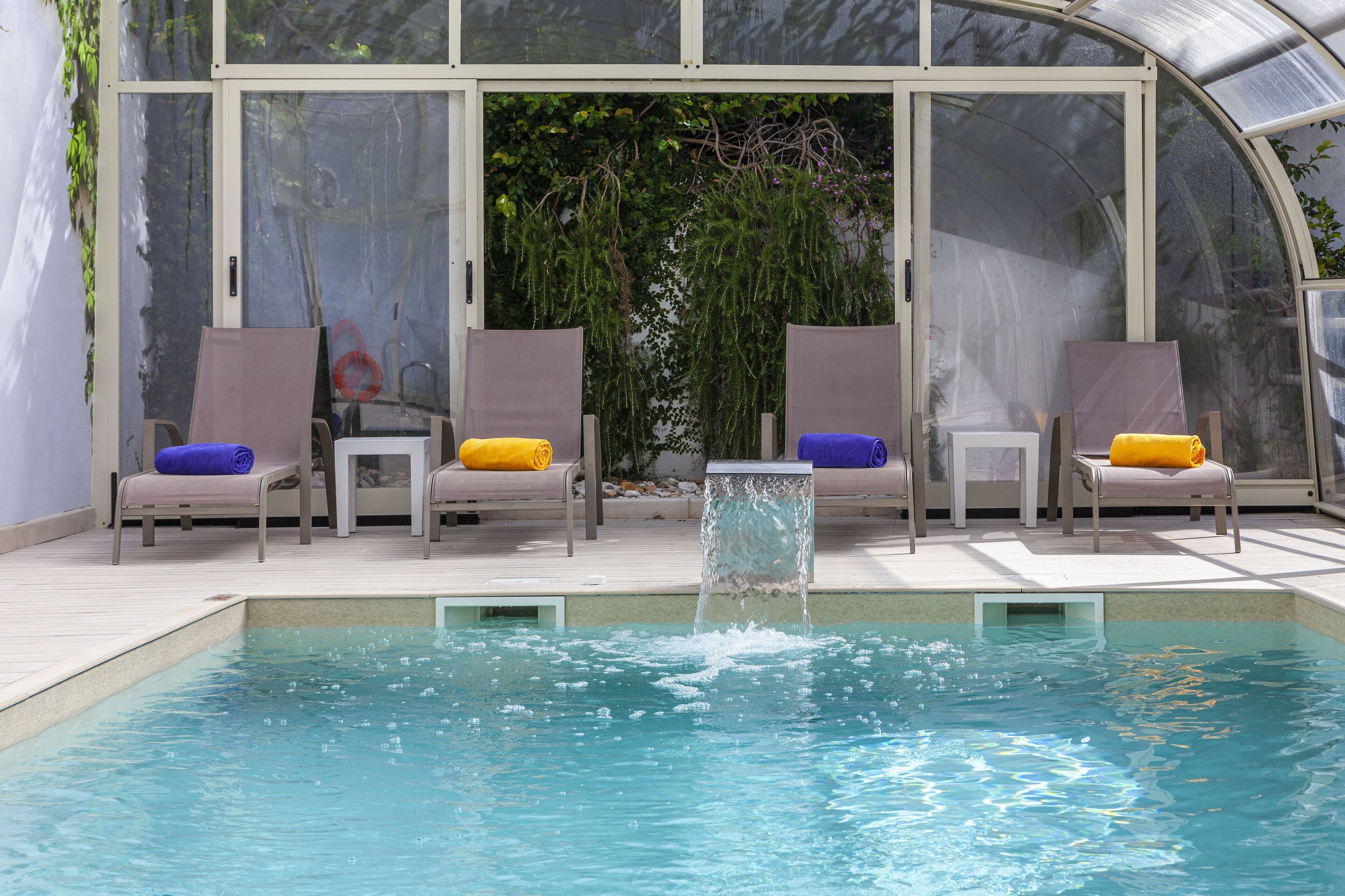 indoor pool, seasonal outdoor pool, pool umbrellas, pool loungers