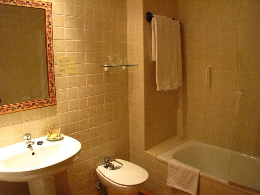 bathtub, hair dryer, towels