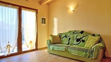 Apartment, 1 Bedroom, Garden View | Living area | Flat-screen TV