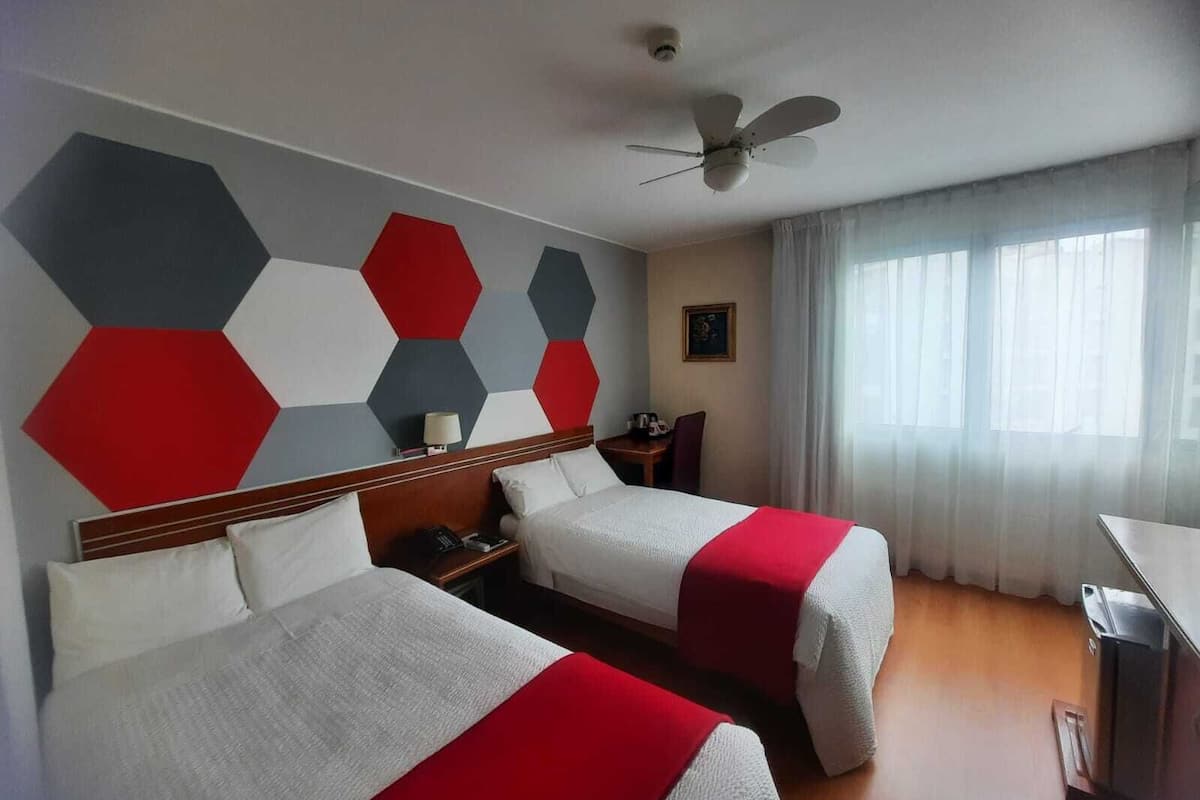 Standard Twin Room | Minibar, in-room safe, desk, blackout drapes