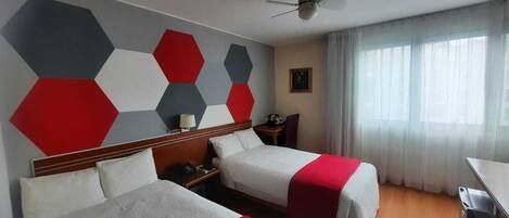 Standard Twin Room | Minibar, in-room safe, desk, blackout drapes