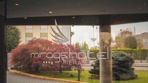 A hotel entrance with a logo and name 'mirage hotel'.