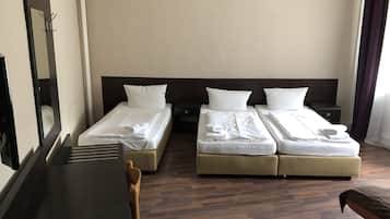 Economy Triple Room, Shared Bathroom | Hypo-allergenic bedding, desk, blackout drapes, iron/ironing board