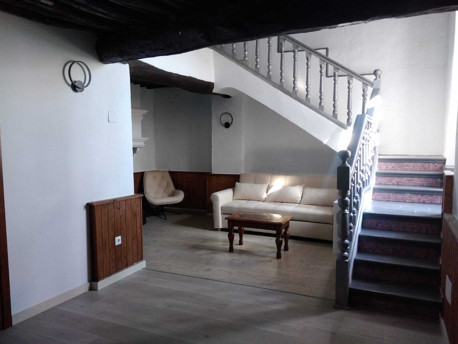 deluxe suite, multiple beds | living area | plasma tv