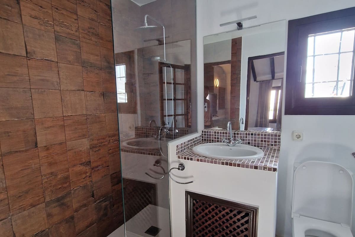 superior double room | bathroom | hair dryer, towels, soap, toilet paper