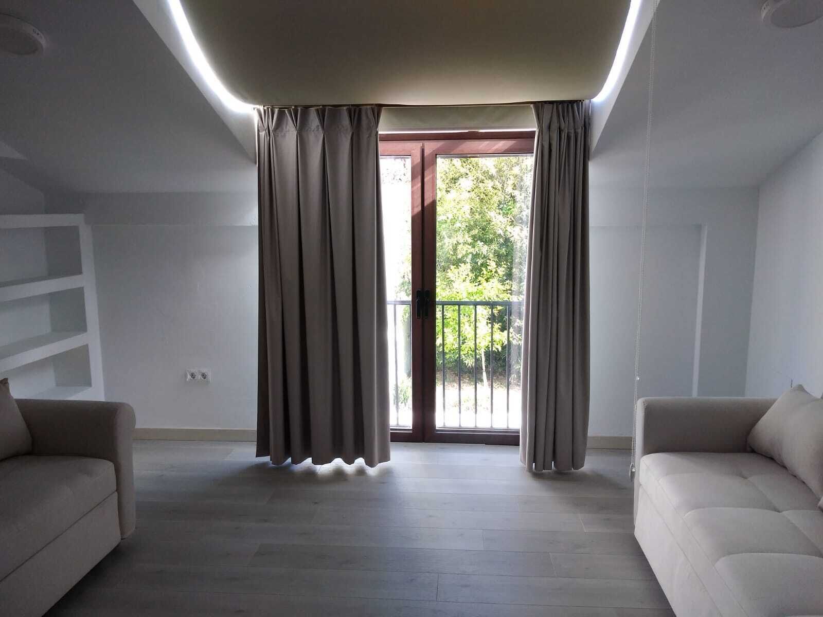 family suite, multiple beds | living area | plasma tv