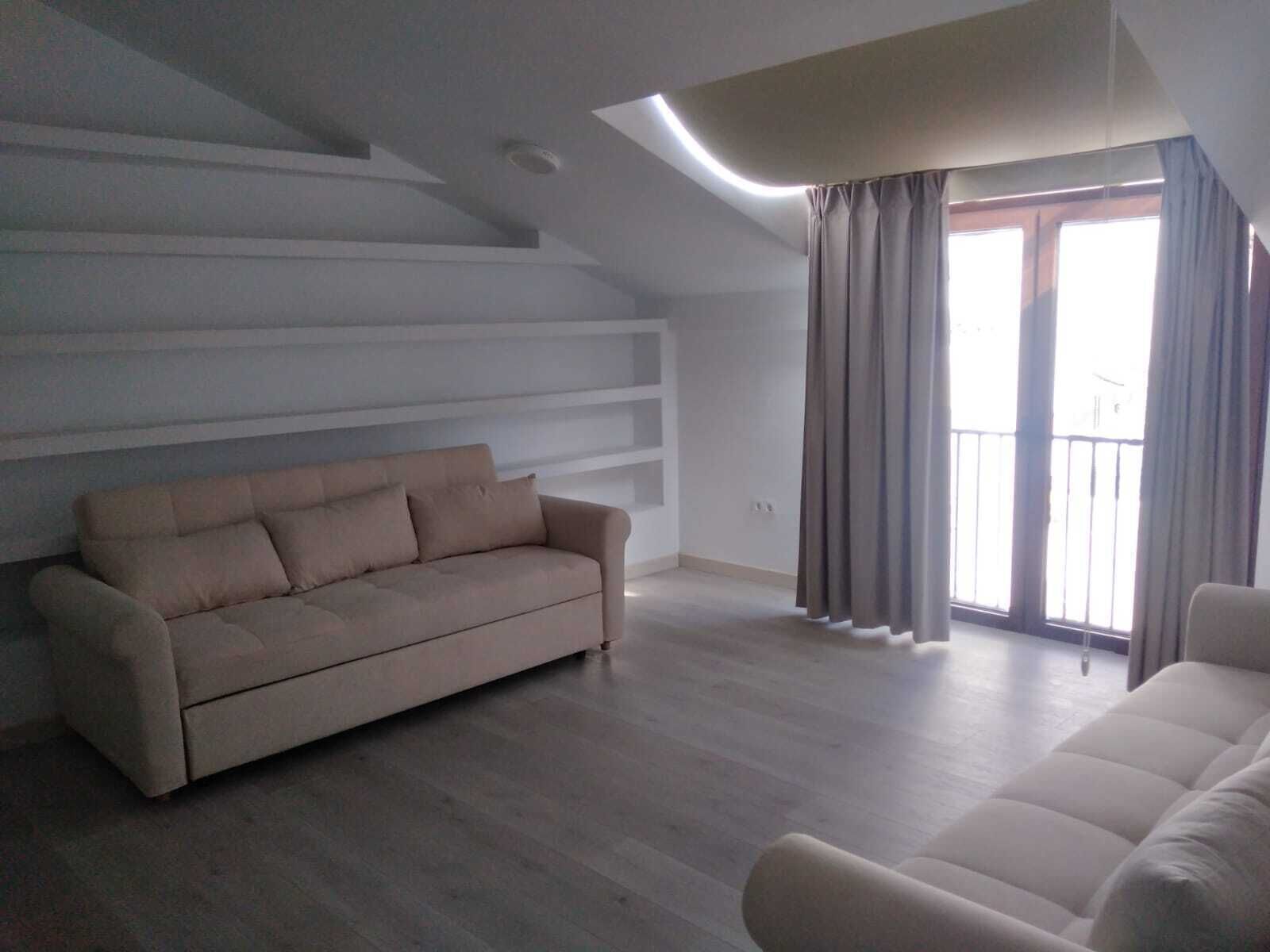 family suite, multiple beds | living area | plasma tv