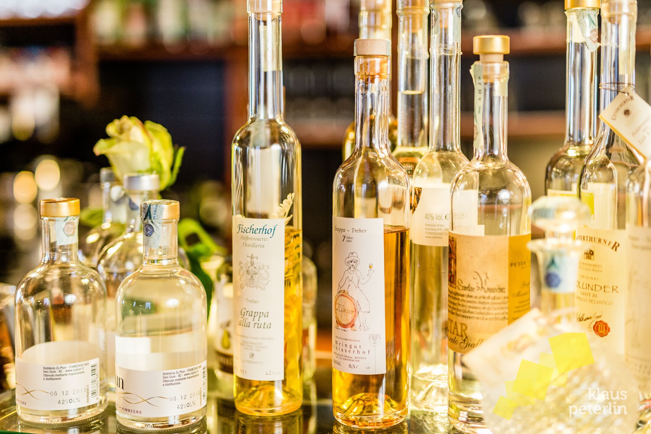 A variety of wine bottles on display, including labels and prices visible.