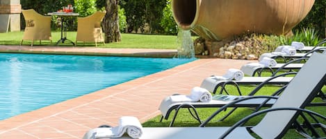 Seasonal outdoor pool, open 8:00 AM to 8:00 PM, pool umbrellas