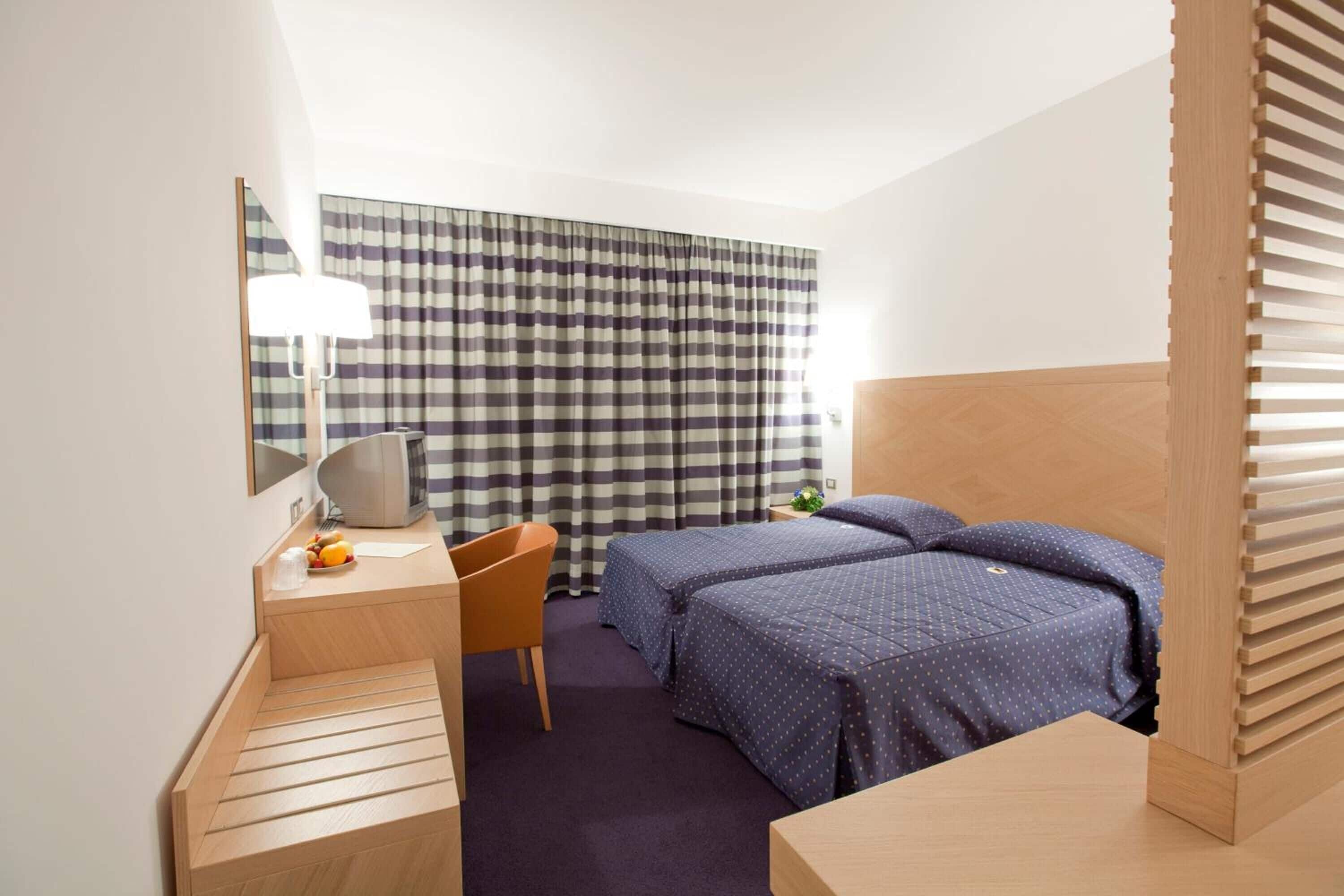 twin room | premium bedding, minibar, in-room safe, desk