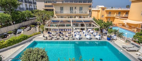 Outdoor pool, open 9:00 AM to 6:30 PM, pool umbrellas, sun loungers