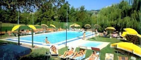 Seasonal outdoor pool, pool umbrellas, pool loungers