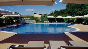 Outdoor pool, open 10:00 AM to 7:00 PM, pool umbrellas, pool loungers