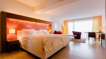Suite Junior, vue parc | 1 chambre, literie hypoallergénique, surmatelas, minibar
