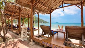 On the beach, free beach cabanas, beach towels, beach massages