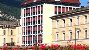 A hotel with a red roof and a sign that reads "EUROPA HOTEL". - Europa (Sondrio)