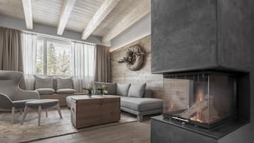 A modern living room with a fireplace, wooden beams, a sofa, and a large window.