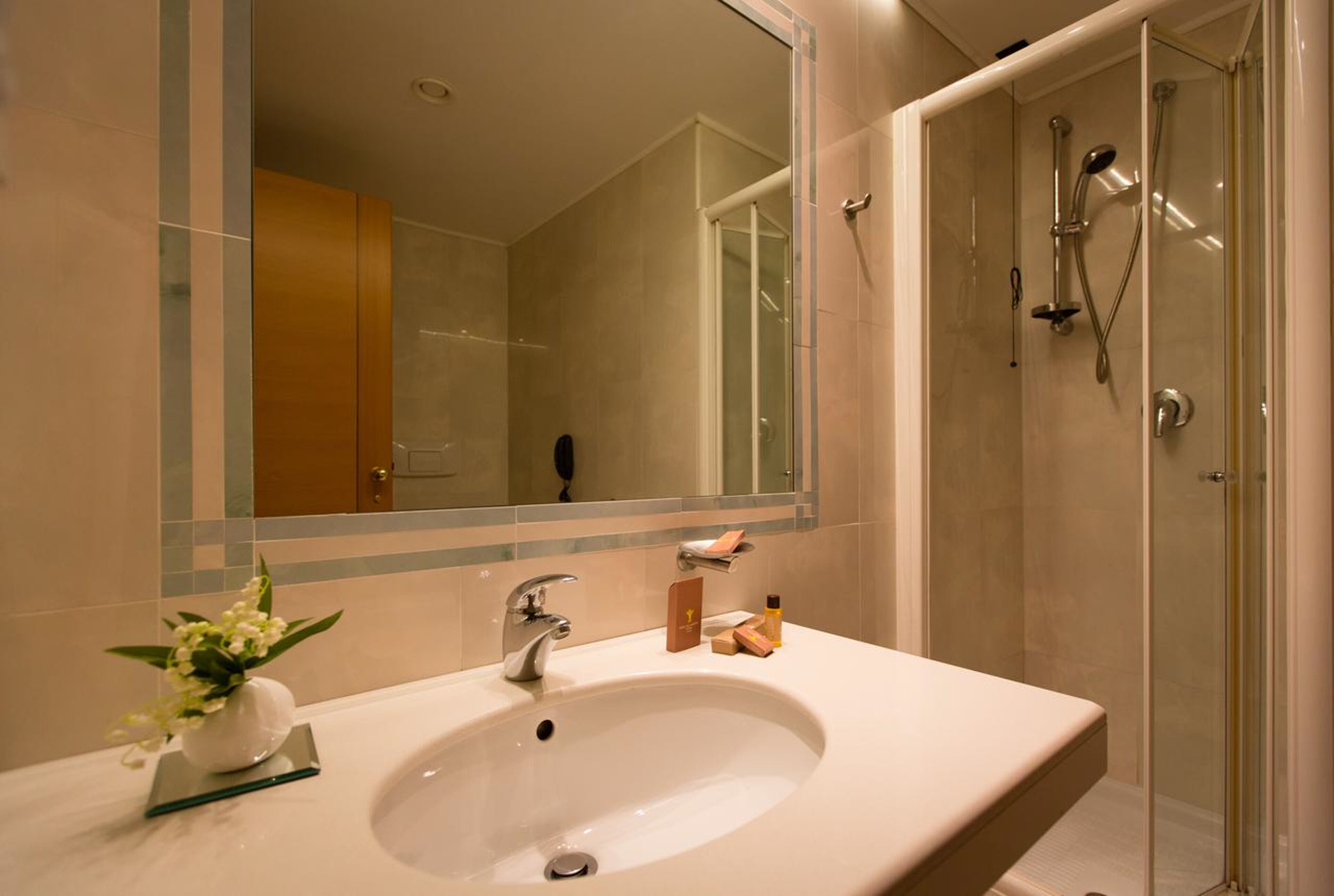 hair dryer, slippers, bidet, towels