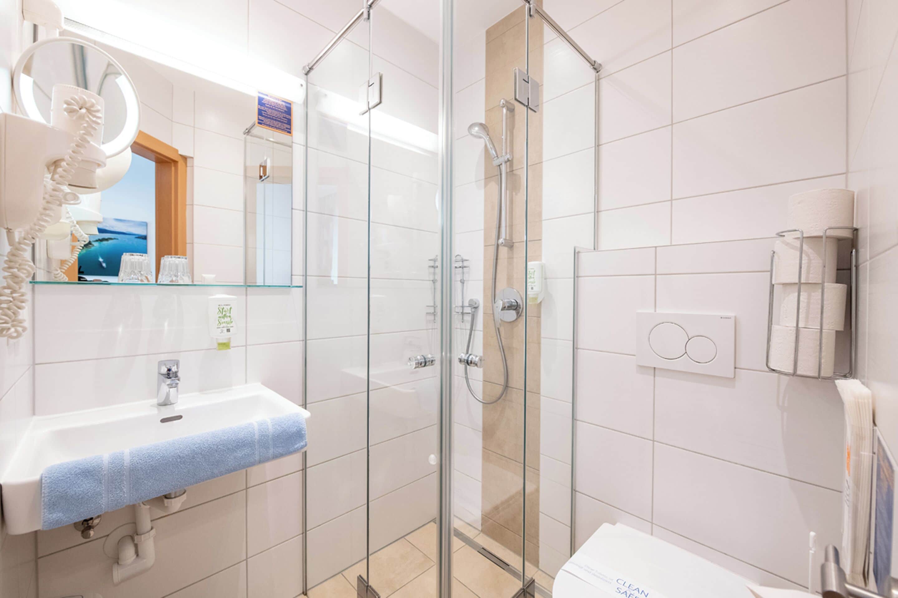 economy studio | bathroom | free toiletries, hair dryer, slippers, towels
