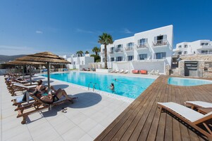 Seasonal outdoor pool, pool umbrellas, pool loungers