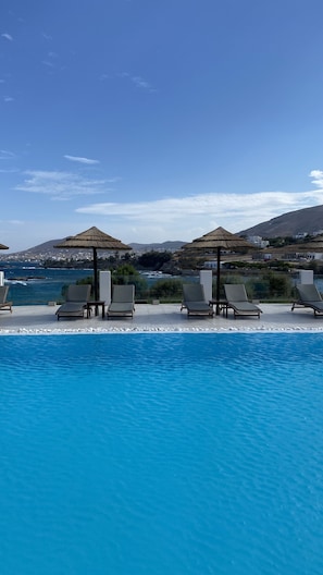Seasonal outdoor pool, pool umbrellas, sun loungers