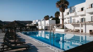 Seasonal outdoor pool, pool umbrellas, pool loungers