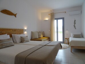 Quadruple Room, Garden View | In-room safe, individually decorated, individually furnished, desk - Paros Bay Hotel (Paros)