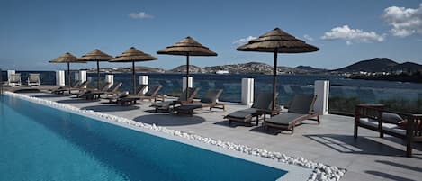 Seasonal outdoor pool, pool umbrellas, sun loungers