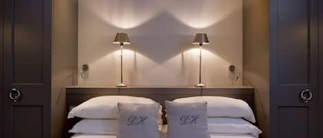 Premium bedding, down comforters, memory foam beds, minibar