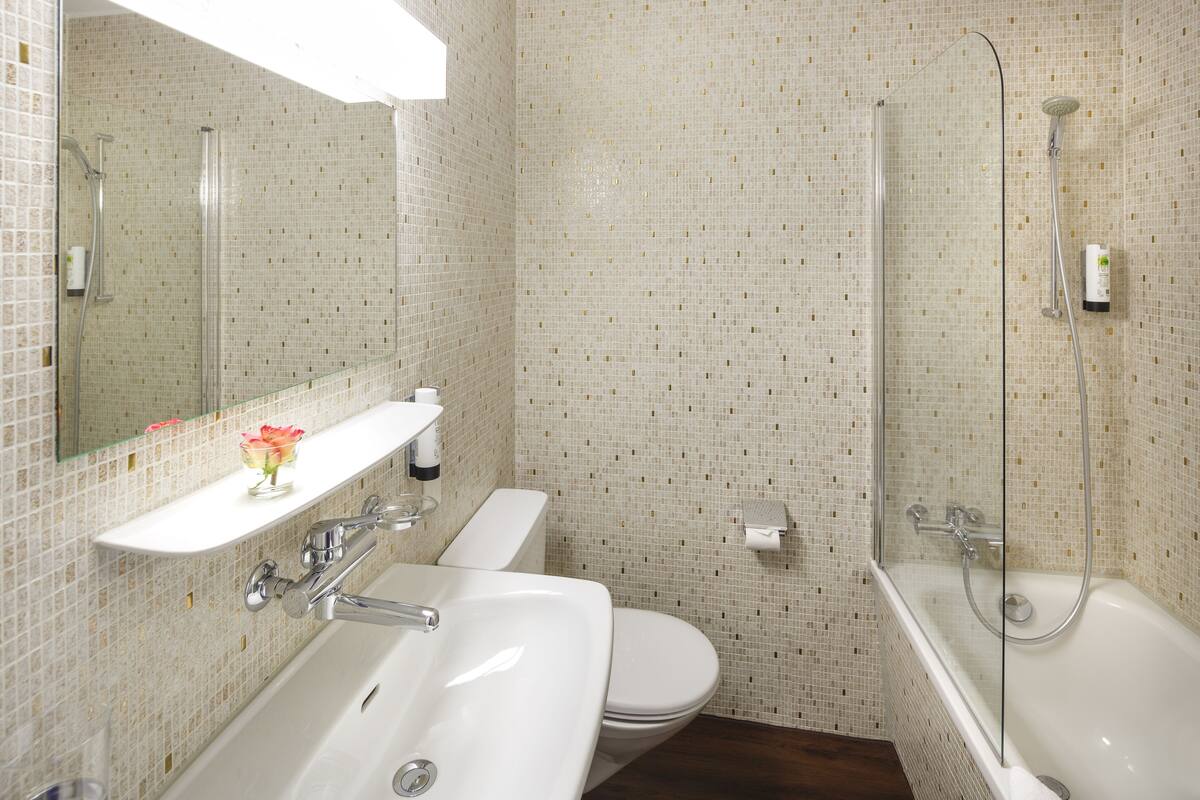 comfort double room, lake view | bathroom | hair dryer, towels