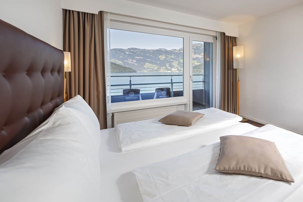 panoramic double or twin room, balcony, lake view | in-room safe, iron/ironing board, bed sheets