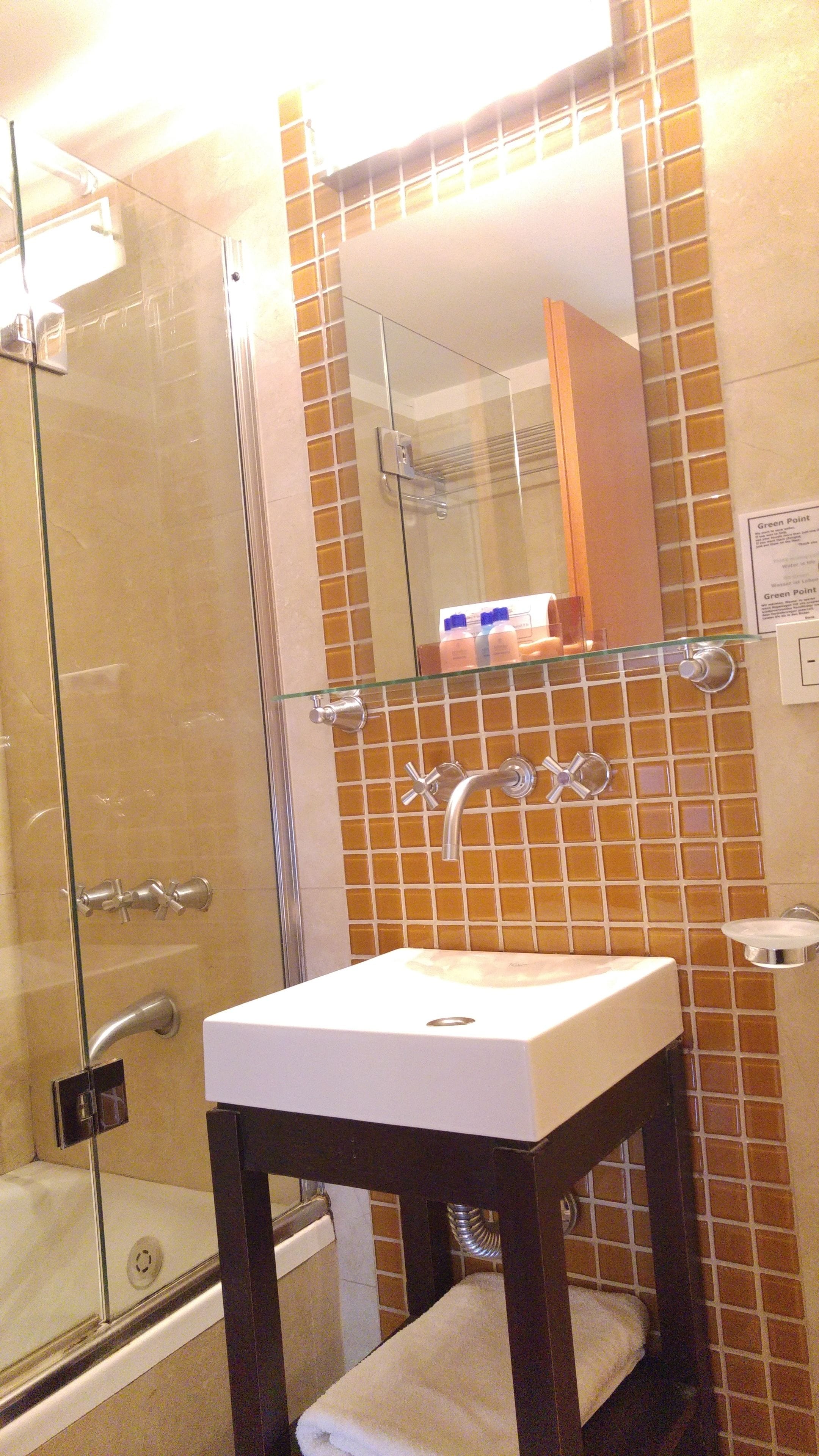 combined shower/bathtub, deep-soaking bathtub, rainfall showerhead