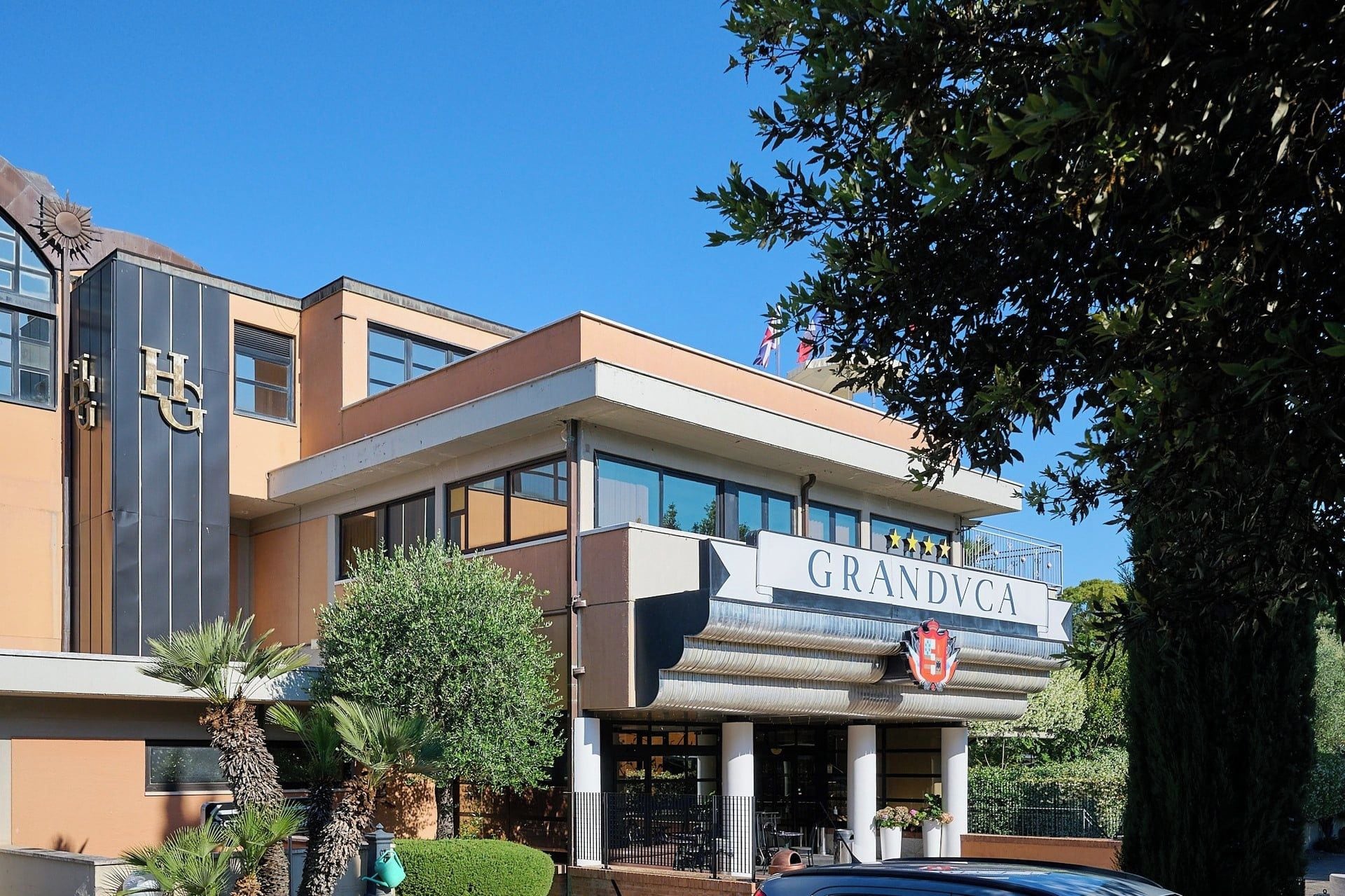A hotel with a prominent sign reading 'GRANDVCA'.