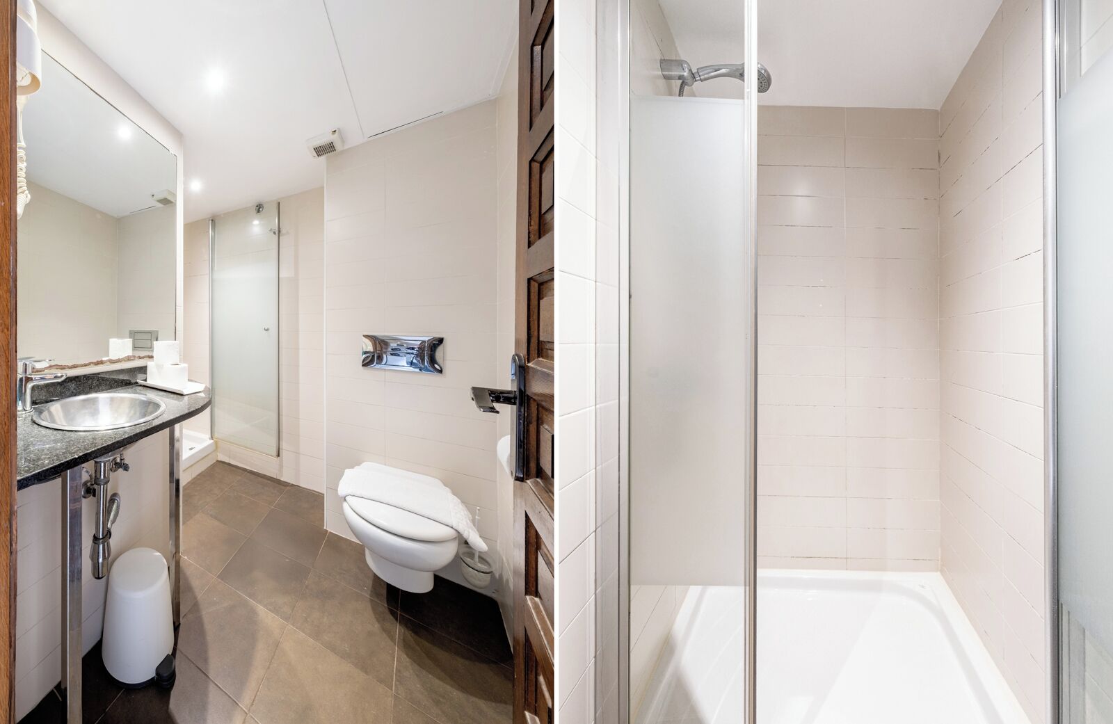Un baño moderno con lavamanos, inodoro y ducha.